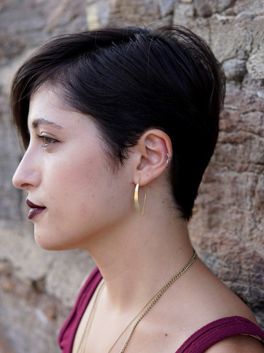 Lightweight half hoop earrings in gold. Fair Anita