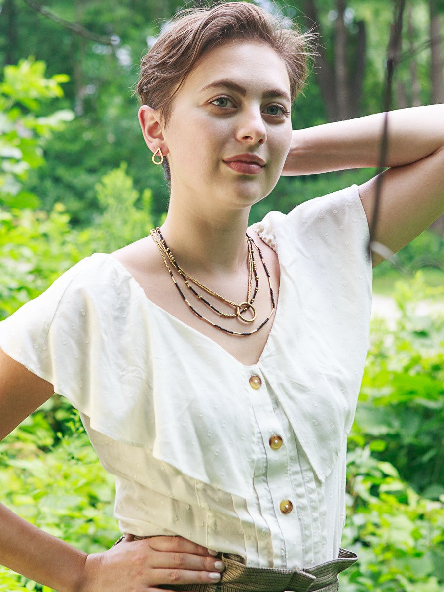 black seed beads and brass pipe necklace | Fair Anita