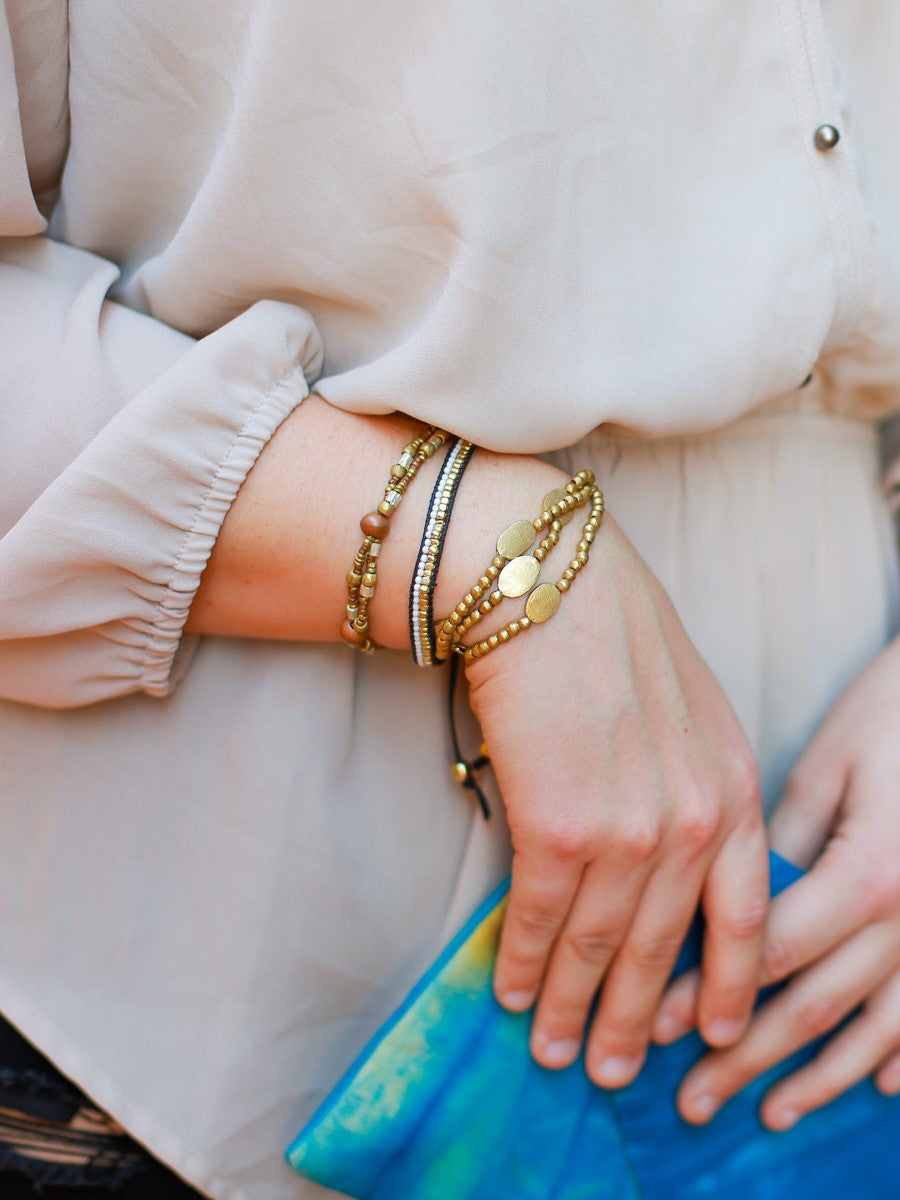 Upcycled artillery elastic bracelet, brass, wudasi, triple strand. Fair Anita